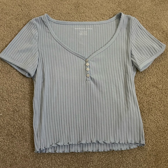 American Eagle Outfitters Tops - Light blue American Eagle crop top with three buttons.